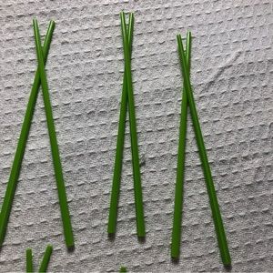 Set of 7 pairs of green plastic chopsticks